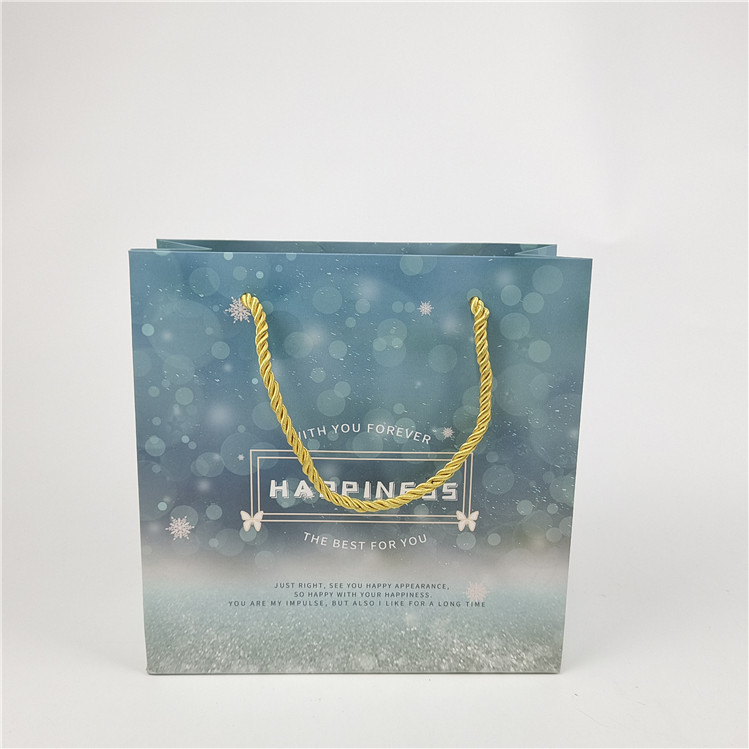 সর্বাধিক বিক্রিত পুনর্ব্যবহারযোগ্য পরিবেশ বান্ধব লোগো মুদ্রিত শপিং পেপার ব্যাগ প্যাকেজিং সাদা 110 গ্রাম পুনরায় ব্যবহারযোগ্য